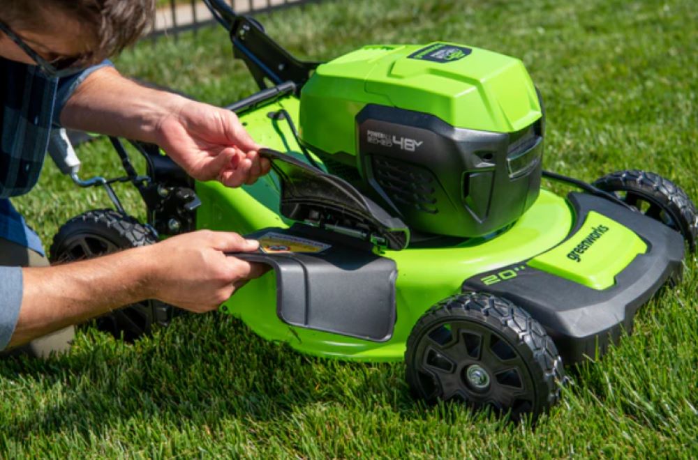 Discharging of gas vs electric lawn mower